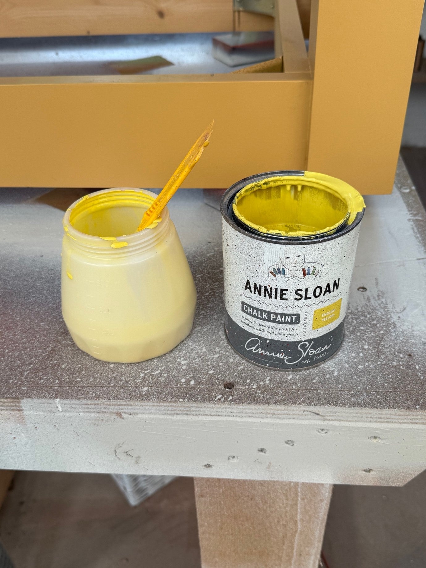 Yellow paint for a wooden dining table