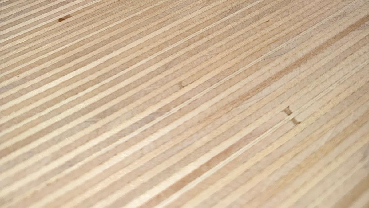 Close up of wooden dining table top finish