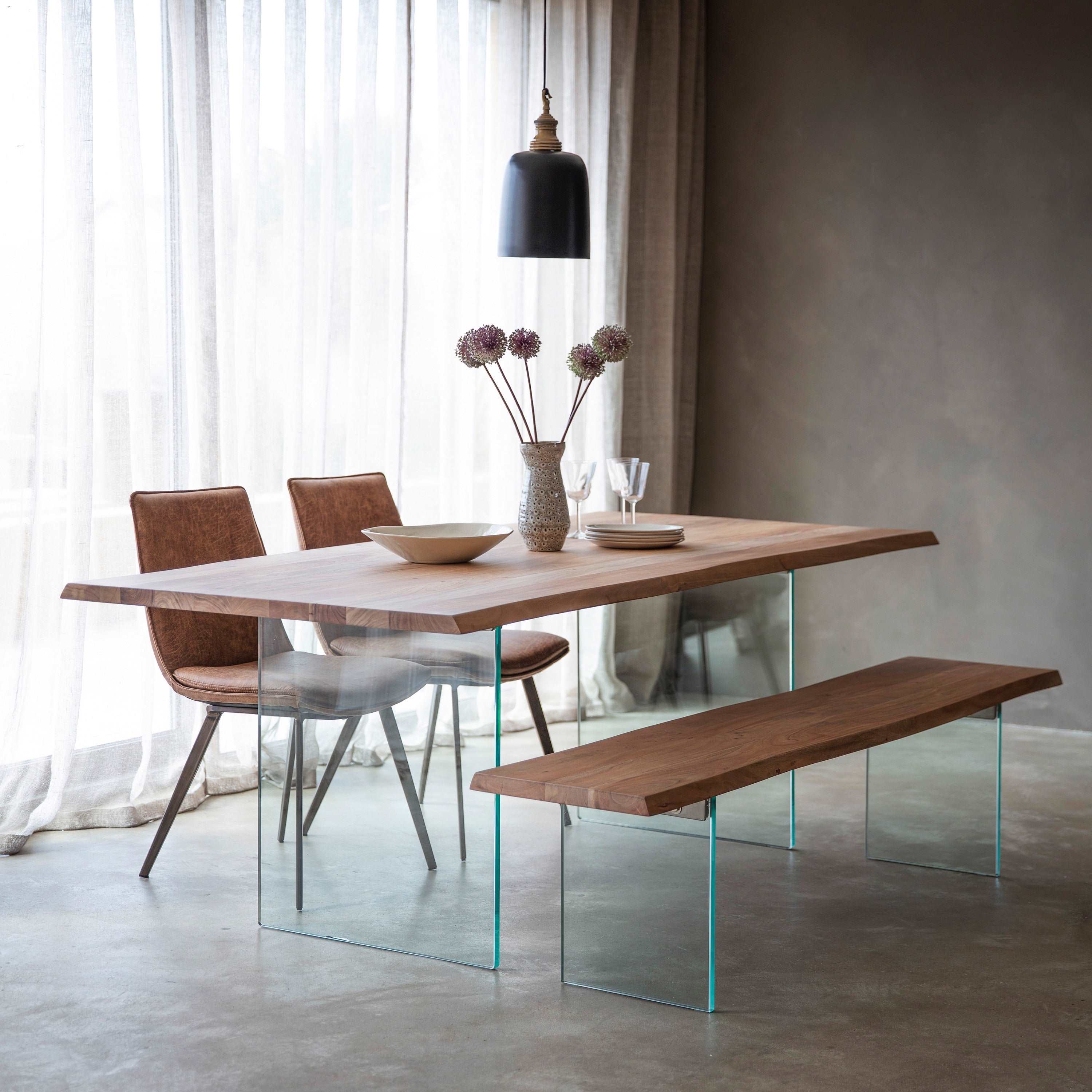 Glaziers dining table with acacia wood top and glass legs